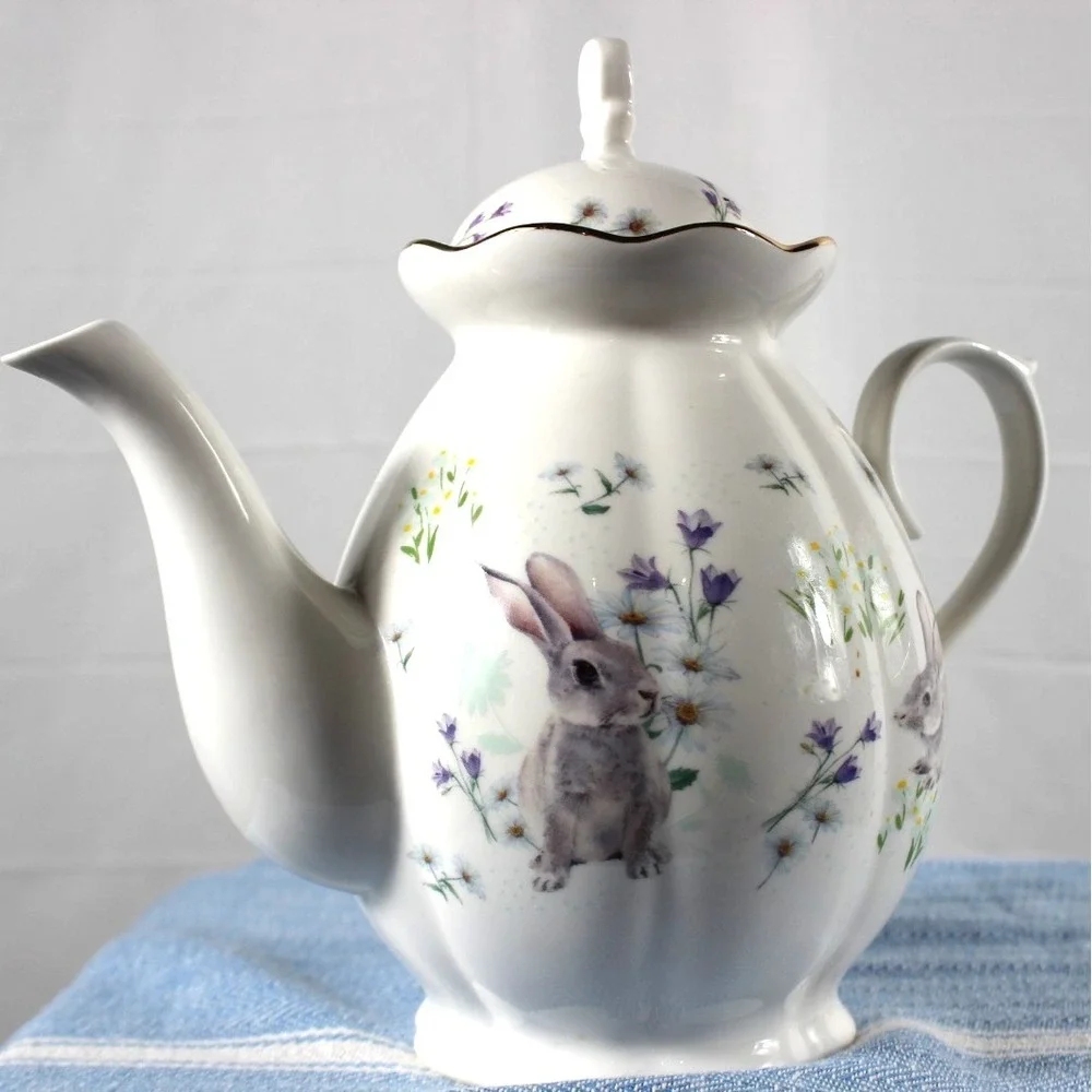 Tea/Coffee pot Elegance rabbit/flower design white bkgrd colored characters VTG